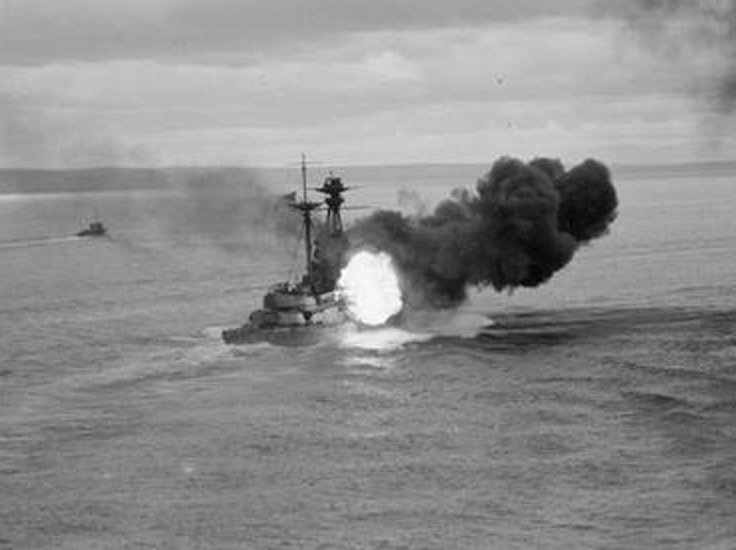 HMS Resolution fires her guns © IWM (Q 18140)